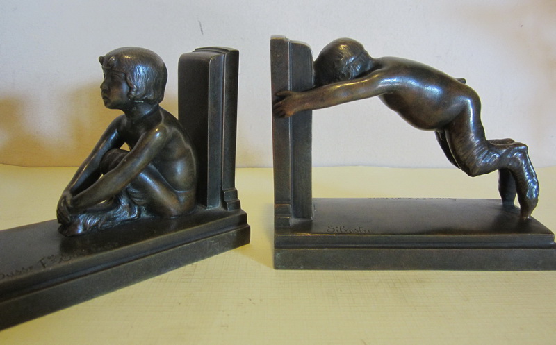 ronze art deco book ends : boy and girl satyrs by the French sculptor Paul Silvestre. Founded by Susse Frres