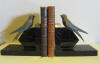 pair of art deco patinated white metal book ends; pair of swallows