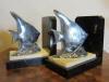 silver plated metal art deco bookends: fish, scalairs on marble base. France, ca 1930. 