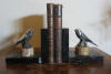 pair of art deco silver plated metal book ends; pair of swallows on marble base