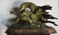 patinated white metal statue of running hunting dogs, by Francisque; France; ca 1920
