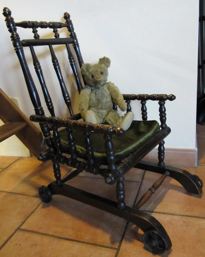 19th century wooden children's chair on 4 metal wheels!  