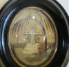 French mourning frame with gorgeous palette hair work: A cemetery with a cross on a tomb, plants, flowers and a willow, symbol of sorrow and grieve. The text: 'souvenir de ma mre; dcde le 12 october 1869 age de 77 ans'. 